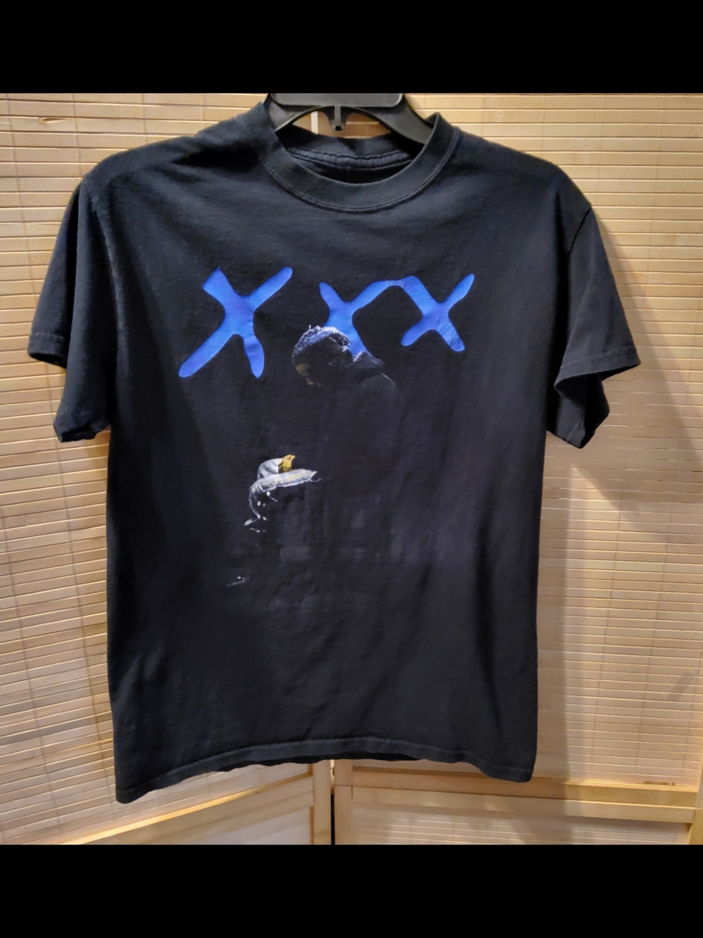 Black Short-Sleeve Graphic Tee with Blue 'XXX' Design